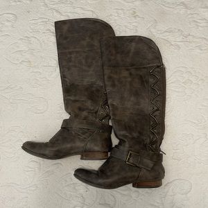 Brown tall boot with zipper back detail